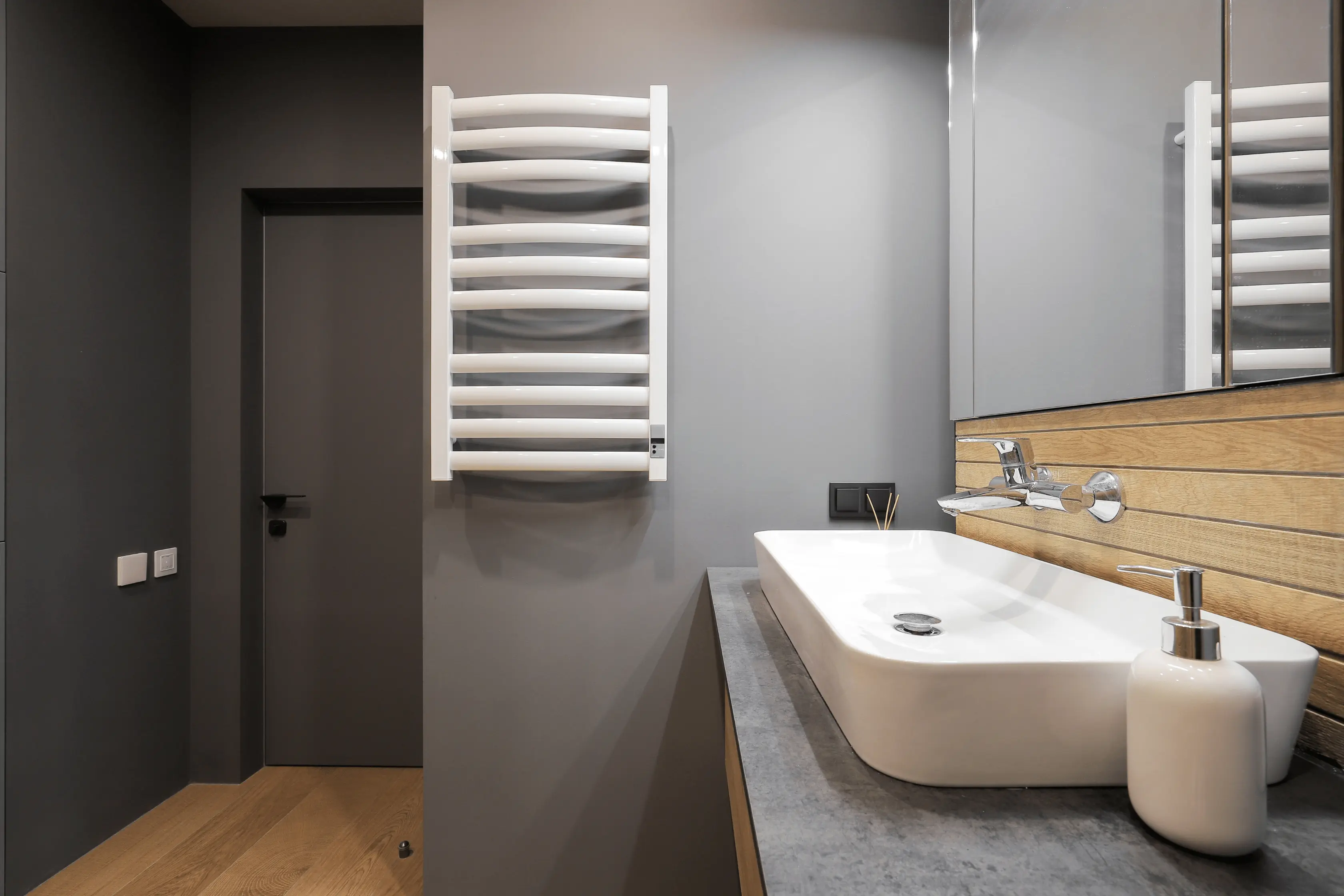 Grey Modern Bathroom Space With Stylistic Towel Rail